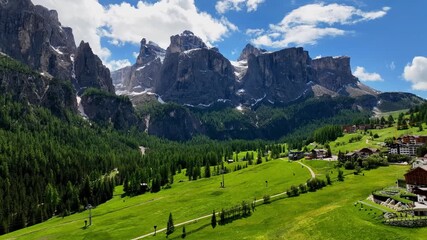 Aerial view above Val di Tires, with the Catinaccio - Torri del Vajolet Rosengarten in the background, South Tyrol, Italy