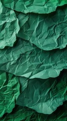 Obraz premium Close-up of wrinkled green paper texture, ideal for scrapbooking and crafting. Top view