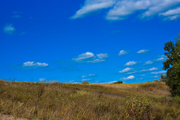 Obraz premium Summer rural landscape with hills and blue sky , photo