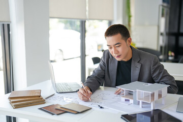 Fototapeta premium Architecture Man drawing on architectural Creative project business architecture building construction&nbsp;Industrial engineering Achievement Planning Design on eco blueprint