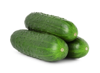 Three fresh green cucumbers isolated on white