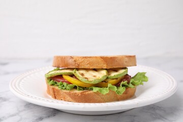 Tasty sandwich with grilled vegetables on white marble table, closeup
