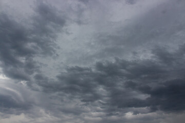 Background of grey stormy sky with heavy rainy clouds. Overcast sky before the storm