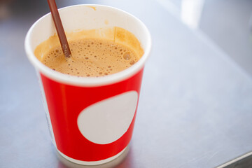 Frothy Coffee in a Red Cup