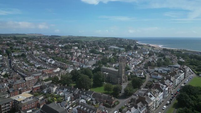 Exmouth, East Devon, England: DRONE VIEWS: Central Exmouth, Holy Trinity Church and the River Exe. Exmouth is a popular UK holiday resort (Clip 2).