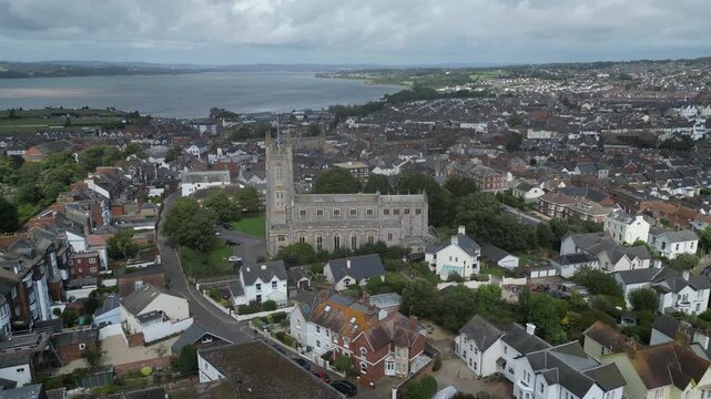 Exmouth, East Devon, England: DRONE VIEWS: Central Exmouth, Holy Trinity Church and the River Exe. Exmouth is a popular UK holiday resort (Clip 1).
