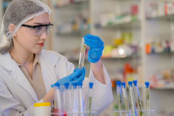 Scientists prepare for the experiment by wearing latex gloves. An experimenter arranges...