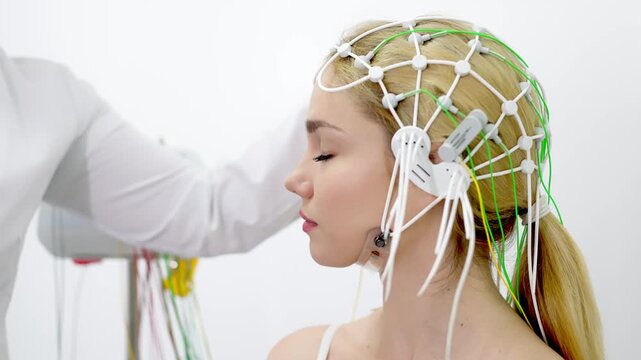 Female patient undergoing an EEG test, showcasing modern healthcare and patient comfort. Perfect for highlighting advanced diagnostic technology and patient-centered care.