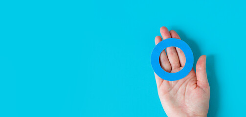 World Diabetes Day. Blue circle in hand is a symbol of diabetes awareness. November 14th