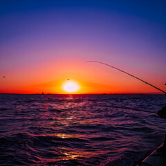 fishing at sunset