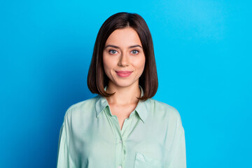 Fototapeta premium Photo of good mood cheerful nice positive woman with bob hairstyle dressed turquoise blouse smiling isolated on blue color background