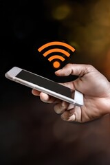 Hand holding mobile phone with visible wifi icon on black background showcasing wireless technology, modern connectivity, digital communication