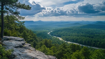 Obraz premium A mountain range with a river running through it