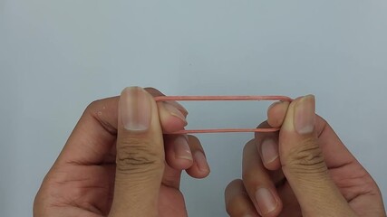 red rubber band on a white background