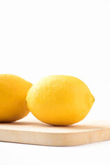 Fresh ripe yellow lemon fruit on white background