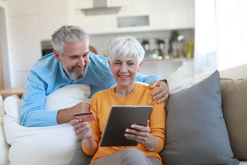 couple credit woman tablet shopping card online senior elderly retirement adult old retired mature senior couple pensioner older active two aged vitality online shopping finace buying bill