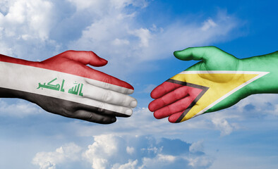 Iraq and Guyana country handshaking with flags, consensus concept international co-operation illustration