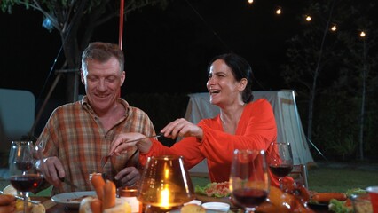 Family gather celebrate holiday. Parents, grandparents and girl together to talk and have dinner...