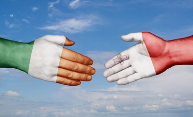 Malta and Ireland country handshaking with flags, consensus concept international co-operation illustration