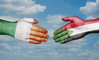 Sudan and Ireland country handshaking with flags, consensus concept international co-operation illustration