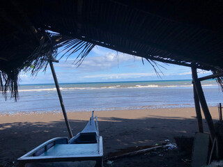 Beautiful view of the sea through the bamboo hut's portal.