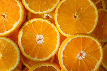 a group of oranges cut in half