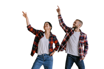 Cheerful couple in casual matching outfits pointing upwards, sharing a moment of joy and excitement. Both are dressed in plaid shirts, isolated on transparent background