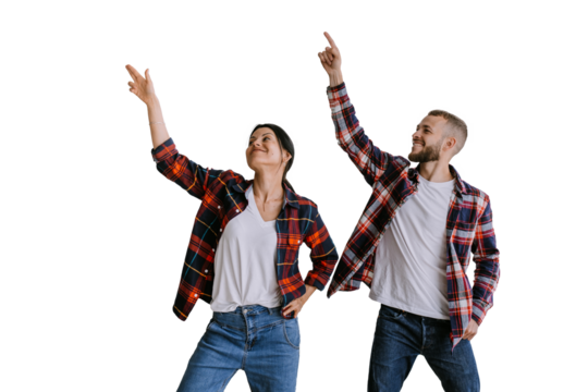 Cheerful couple in casual matching outfits pointing upwards, sharing a moment of joy and excitement. Both are dressed in plaid shirts, isolated on transparent background