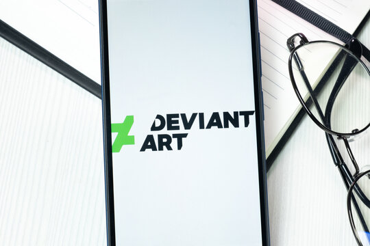 New York, USA - 10 August 2024: DeviantArt Logo on Phone Screen, Company Icon on Display