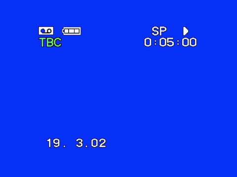 Old VHS video camera interface with noise. Footage of VHS recording with timecode. Old screen with date and timecode. Blue screen. 4:3 format.