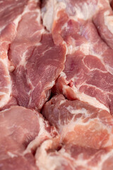 a sliced piece of pork meat from the neck