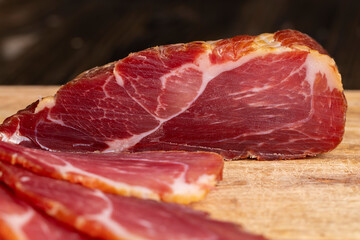 a piece of cured pork ham with thin layers of lard