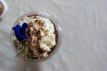 Top view of whipping cream. Sweet topping of drink