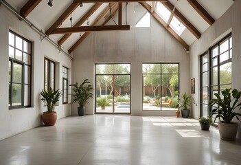 Fototapeta premium an empty room with plants and windows.