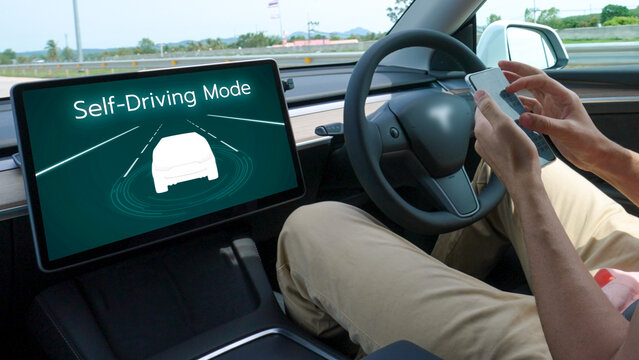Self driving car or autonomous vehicle travel on speed highway with driverless system and autopilot mode allowing man driver relax and focus on smartphone without compromising safety. Perpetual