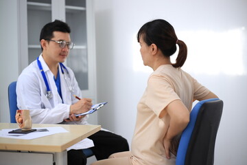 Fototapeta premium Male doctor with experience examining young pregnant women