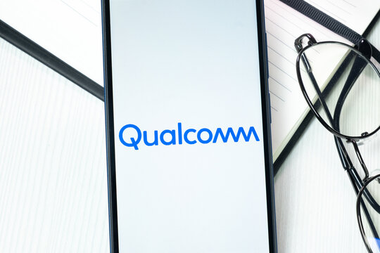 New York, USA - 10 August 2024: Qualcomm Logo on Phone Screen, Company Icon on Display