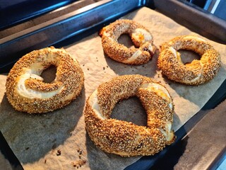 Freshly made Simit coming from the oven. Turkish bagel. 
