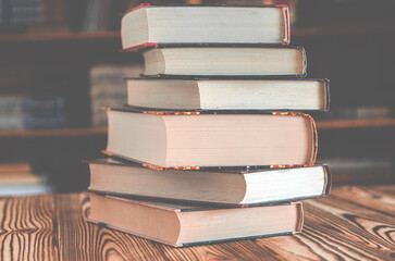 Old books are stacked in the library. Books