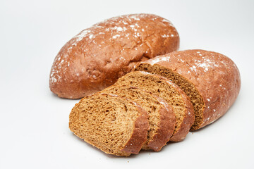 Freshly baked rye bread with a rustic crust, perfect for sandwiches or as a side on white background