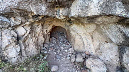 Rocks strewn near cave entrance