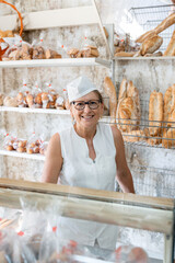 Portrait of a female baker in a bakery shop