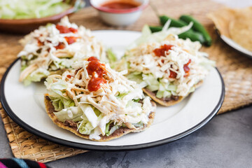 mexican tostadas with chicken, cooking traditional homemade food in Mexico Latin America	