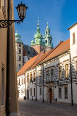 Fototapeta premium Krakow old town, Kanonicza street and Wawel castle with cathedral towers in the morning.
