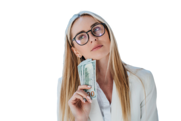 Thoughtful blonde woman in a white suit holding cash, pondering financial decisions. Wearing glasses, isolated on transparent background
