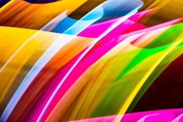 A colorful, abstract painting with a rainbow of colors. The painting is full of energy and movement, with the colors blending and swirling together. The overall mood of the painting is vibrant