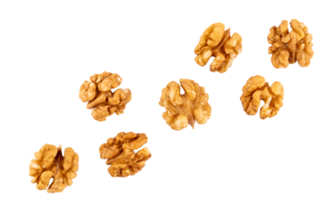 Pile of peeled walnuts, raw nuts closeup, graphic element isolated on a transparent background