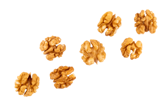 Pile of peeled walnuts, raw nuts closeup, graphic element isolated on a transparent background