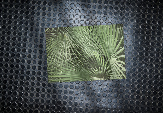 Overhead view of a paper on a black rubber floor with relief. Customizable mockup. Lights and shadows