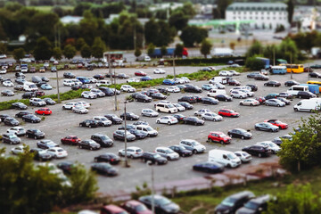 Huge parking lot with many cars in a sleeping area of big city. Transportation and transport modes in an urban environment. A parking lot for vehicles © vita